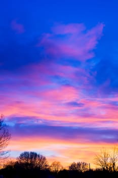 sunset over farm field landscape