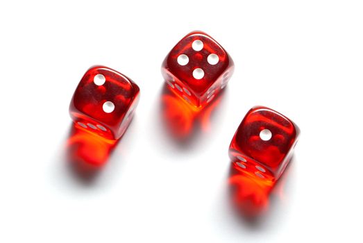 Red glass cubes (three pieces). A white isolated background.