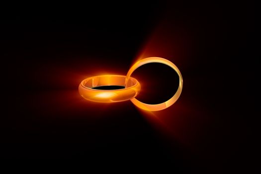 Two wedding rings on a black background. Used a glow effect. 