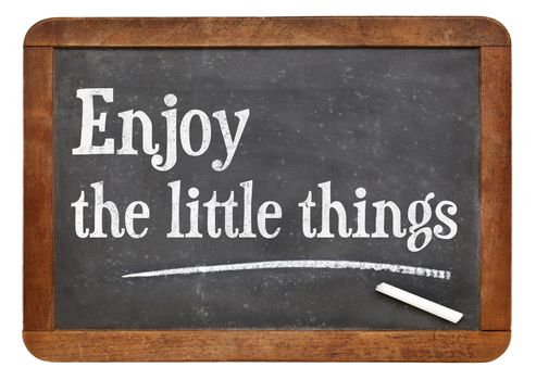 Enjoy little things - inspirational words on a vintage slate blackboard