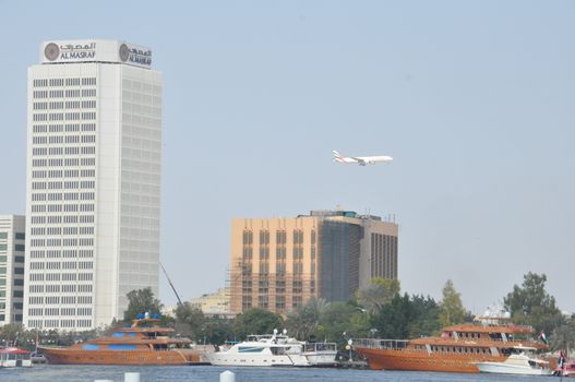 Dubai Creek in Dubai, UAE. The notable buildings along the Deira Creek are Deira Twin Towers, Dubai Creek Tower, National Bank, and Chamber of Commerce.