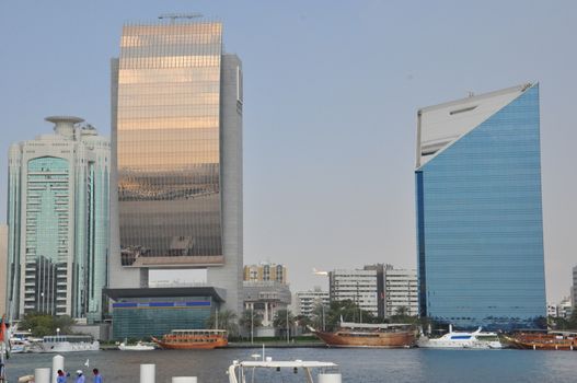 Dubai Creek in Dubai, UAE. The notable buildings along the Deira Creek are Deira Twin Towers, Dubai Creek Tower, National Bank, and Chamber of Commerce.