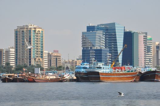 Dubai Creek in Dubai, UAE. The notable buildings along the Deira Creek are Deira Twin Towers, Dubai Creek Tower, National Bank, and Chamber of Commerce.