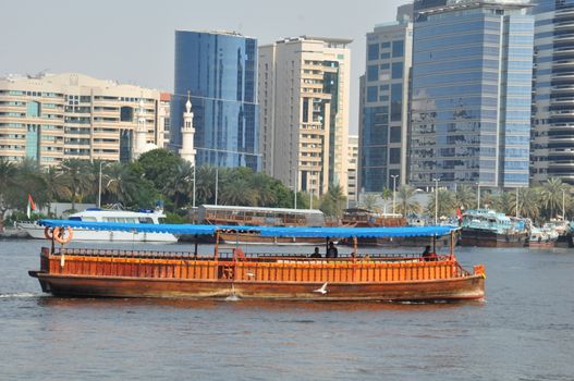 Dubai Creek in Dubai, UAE. The notable buildings along the Deira Creek are Deira Twin Towers, Dubai Creek Tower, National Bank, and Chamber of Commerce.