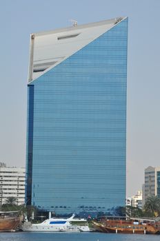 Dubai Creek in Dubai, UAE. The notable buildings along the Deira Creek are Deira Twin Towers, Dubai Creek Tower, National Bank, and Chamber of Commerce.