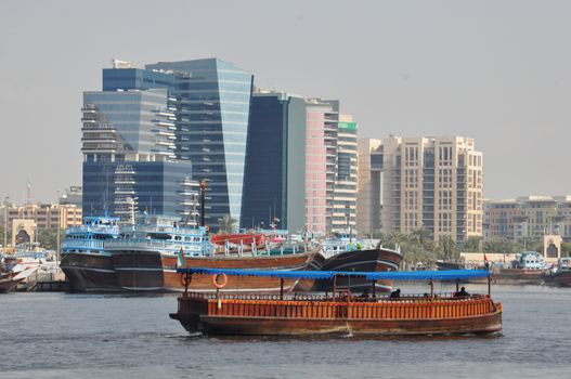 Dubai Creek in Dubai, UAE. The notable buildings along the Deira Creek are Deira Twin Towers, Dubai Creek Tower, National Bank, and Chamber of Commerce.