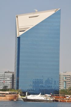 Dubai Creek in Dubai, UAE. The notable buildings along the Deira Creek are Deira Twin Towers, Dubai Creek Tower, National Bank, and Chamber of Commerce.