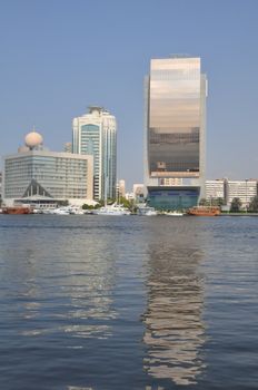 Dubai Creek in Dubai, UAE. The notable buildings along the Deira Creek are Deira Twin Towers, Dubai Creek Tower, National Bank, and Chamber of Commerce.