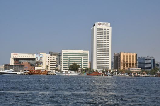 Dubai Creek in Dubai, UAE. The notable buildings along the Deira Creek are Deira Twin Towers, Dubai Creek Tower, National Bank, and Chamber of Commerce.