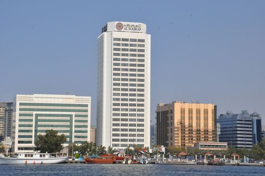 Dubai Creek in Dubai, UAE. The notable buildings along the Deira Creek are Deira Twin Towers, Dubai Creek Tower, National Bank, and Chamber of Commerce.