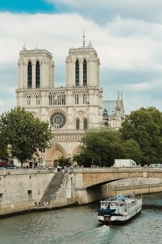 Paris, Notre Dame  with boat on Seine, France