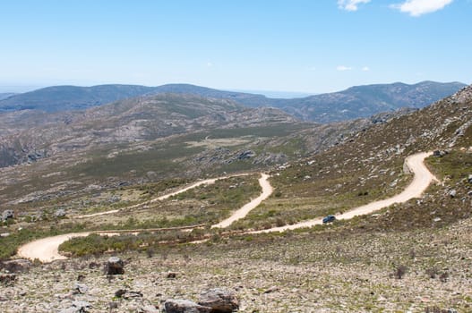 SWARTBERG PASS, SOUTH AFRICA - JANUARY 2, 2015: Hairpin bends in the historic Swartberg (Black Mountain) Pass. The pass is a declared national monument.