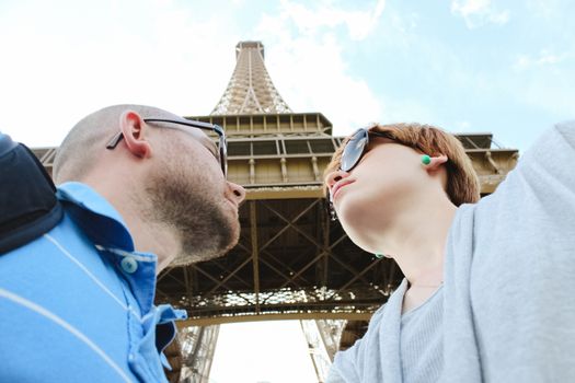 Young romantic couple near the Eiffel Tower in Paris