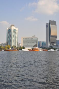 Dubai Creek in Dubai, UAE. The notable buildings along the Deira Creek are Deira Twin Towers, Dubai Creek Tower, National Bank, and Chamber of Commerce.