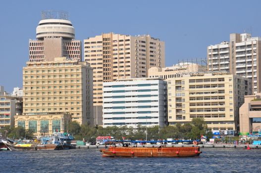 Dubai Creek in Dubai, UAE. The notable buildings along the Deira Creek are Deira Twin Towers, Dubai Creek Tower, National Bank, and Chamber of Commerce.