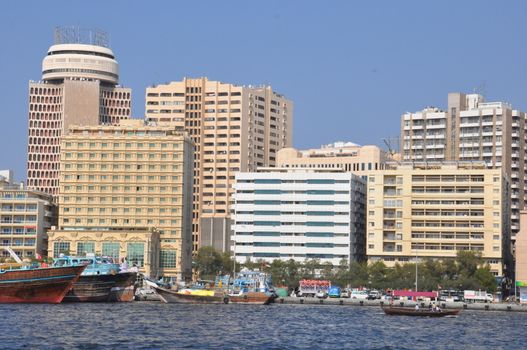 Dubai Creek in Dubai, UAE. The notable buildings along the Deira Creek are Deira Twin Towers, Dubai Creek Tower, National Bank, and Chamber of Commerce.