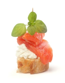 Isolated canape with soft cheese and salmon on the toothpick