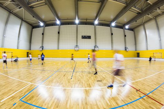 interior of a modern multifunctional gymnasium with young people