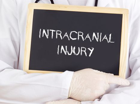 Doctor shows information on blackboard: intracranial injury