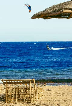 Sea beach with kite surfer