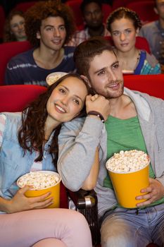 Young people watching a film at the cinema