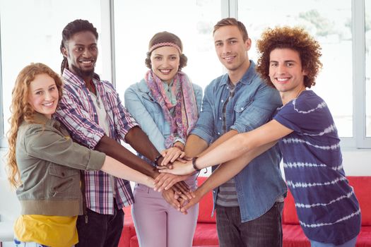 Fashion students smiling at camera together at the college