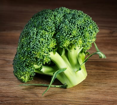 Raw broccoli on wooden background