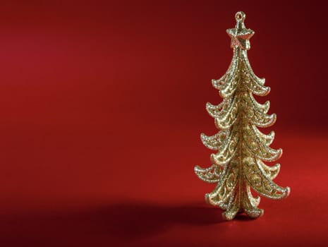 Christmas tree on dark red background