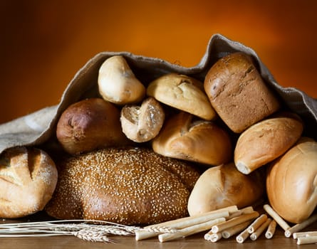 Bread assortment on fireplace background