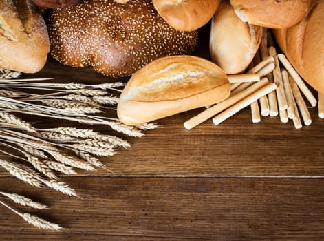 Fresh bread on wooden background