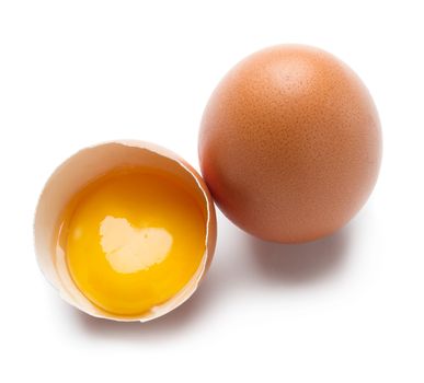 Egg with heart shape on yolk isolated on white background