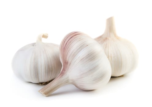 Three raw garlic isolated on white background
