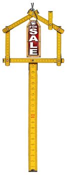 Yellow wooden meter ruler in the shape of house and label with text for sale. For sale real estate sign isolated on white background