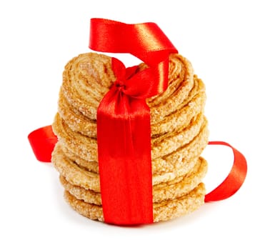 Cookies with red ribbon isolated on white background