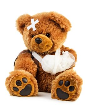 Teddy bear with bandage isolated on white background