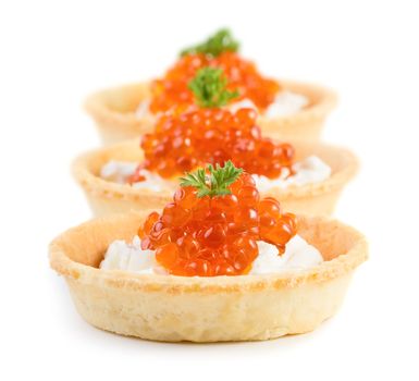 Three caviar snacks isolated on white background