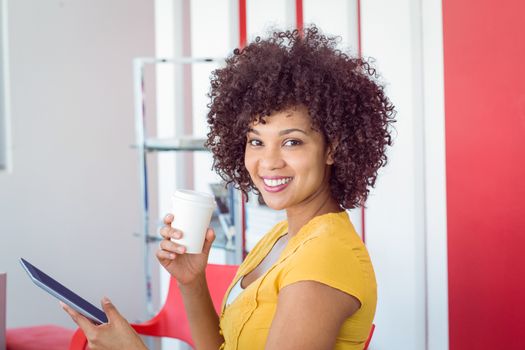 Fashion student smiling at camera at the college