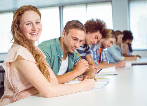 Fashion students taking notes in class at the college