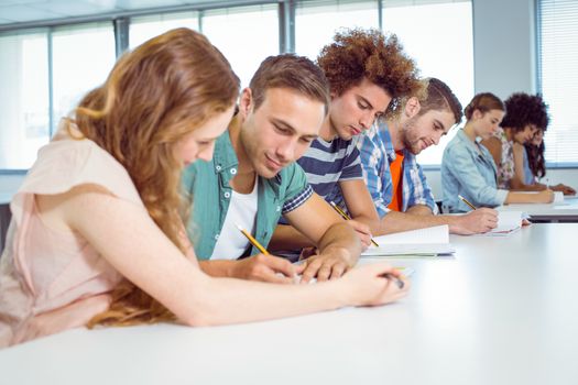 Fashion students taking notes in class at the college