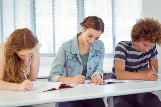 Fashion students taking notes in class at the college