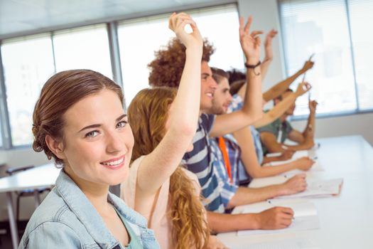 Fashion students being attentive in class at the college