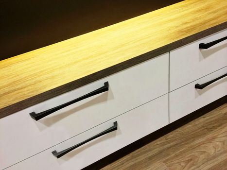 Chest of drawers with wooden top. Modern furniture.