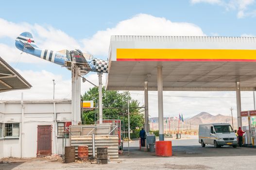 TOUWS RIVER, SOUTH AFRICA - DECEMBER 2, 2014: An aeroplane wreck mounted in such a way as if it hit the roof at a local gas station