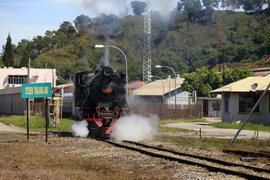 Kota Kinabalu, Malaysia - January 03, 2015: Tourist train North Borneo Railway is an old steam colonial era (engine runs on burning wood). This is a joint project between the railroad and the resort Sabah Sutera Harbour Resort. Currently, tourist train runs from Tanjung Aru in Papar, 38.5 km route.