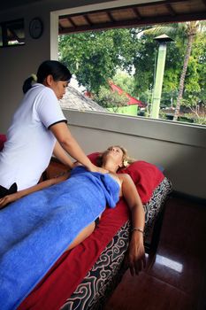 White woman on massage in Bali salon