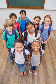 Smiling pupils in classroom at the elementary school