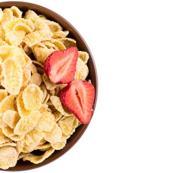 Close up view of bowl with cornflakes and strawberries isolated on white background 