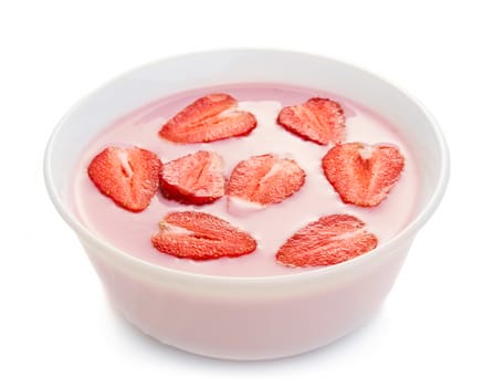 Yogurt with strawberries in bowl isolated on white background