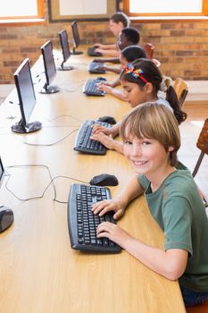 Cute pupils in computer class at the elementary school