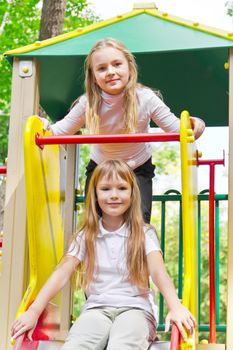 Photo of two active girls on nursery platform